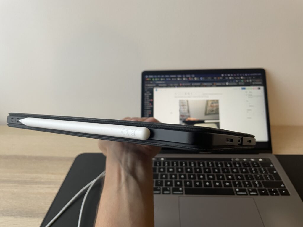 ipad magic keyboard with pitaka magez 2 case and apple pencil. Macbook pro in the background
